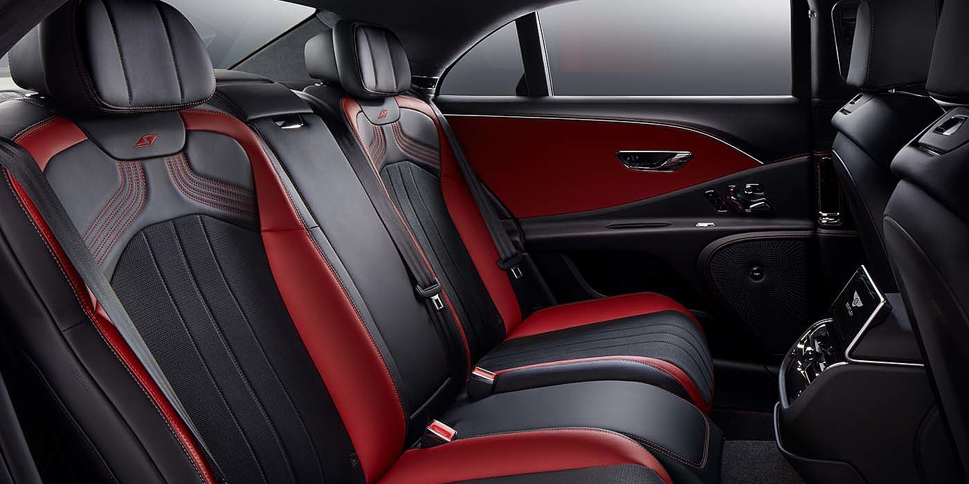 Bentley Sydney Bentley Flying Spur S sedan rear interior in Beluga black and Hotspur red hide with S stitching