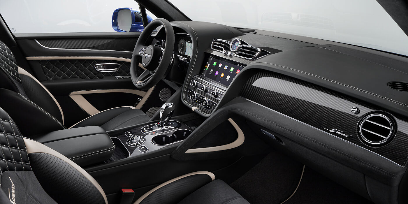 Bentley Sydney Bentley Bentayga Speed SUV front interior in Beluga black and Linen hide with carbon fibre veneer