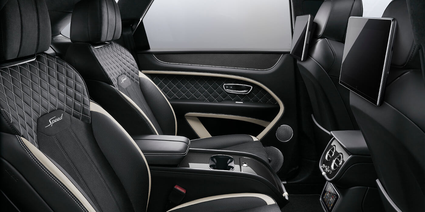 Bentley Sydney Bentley Bentayga Speed SUV rear interior in Beluga black and Linen hide with carbon fibre veneer