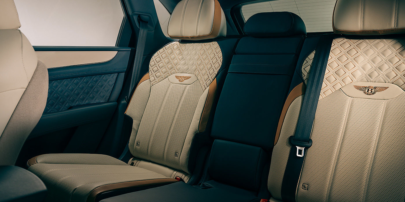 Bentley Sydney Bentley Bentayga Odyssean Edition SUV rear interior in Linen and Brunel hides with diamond in diamond seat stitching