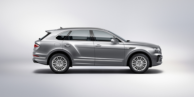 Bentley Sydney Bentley Bentayga SUV side profile in Moonbeam silver paint against white background featuring 21 inch 5 spoke wheels